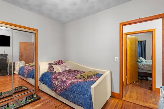 bedroom featuring a closet and hardwood / wood-style floors