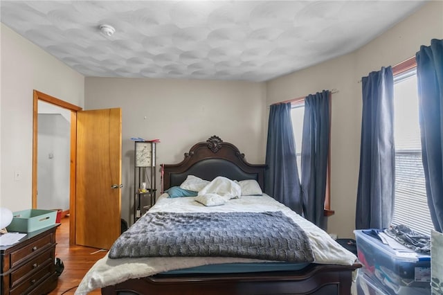 bedroom with light wood-type flooring