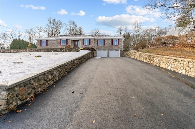 single story home featuring a garage