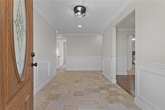 entrance foyer featuring ornamental molding