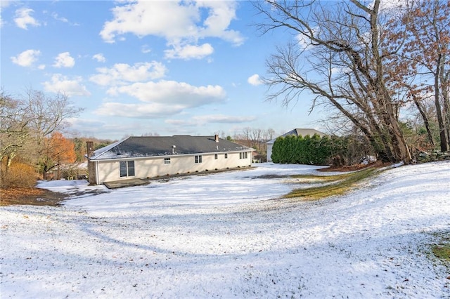 view of snow covered house