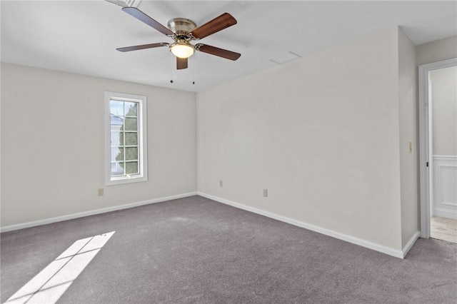 unfurnished room featuring ceiling fan and light colored carpet