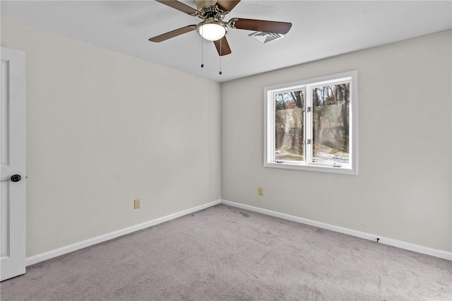 empty room with ceiling fan and light colored carpet