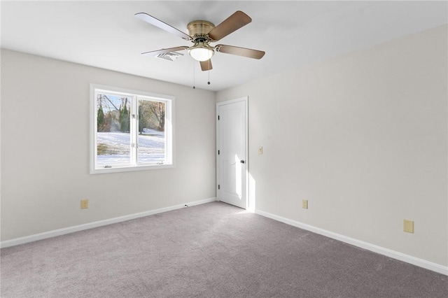 empty room with carpet and ceiling fan