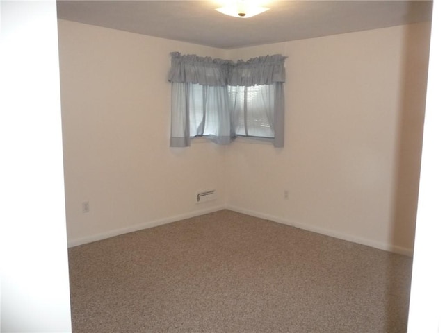 empty room with carpet flooring