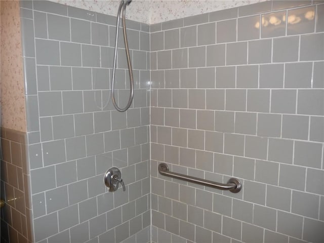 bathroom with a tile shower