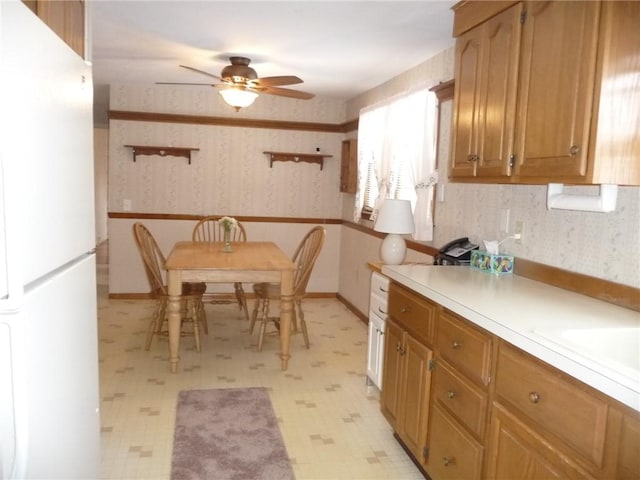 kitchen featuring ceiling fan and white fridge