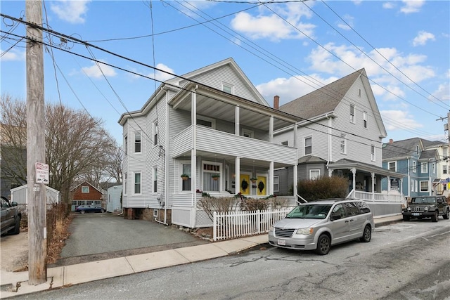 view of front property with a balcony