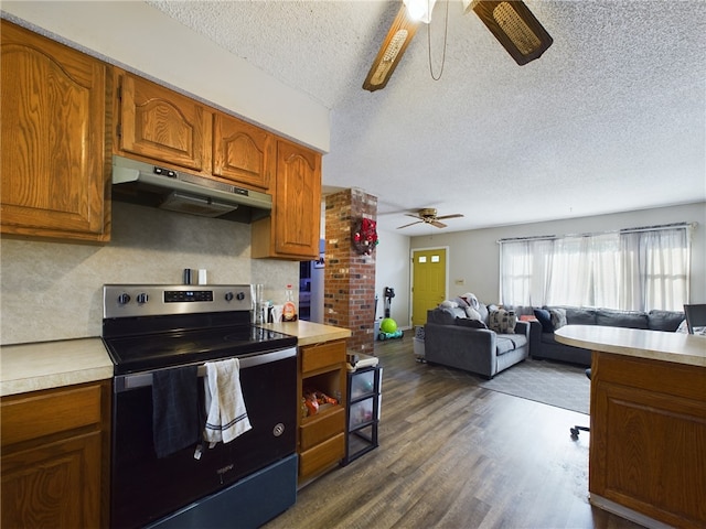 kitchen featuring dark wood-type flooring, ceiling fan, stainless steel range with electric stovetop, tasteful backsplash, and a textured ceiling