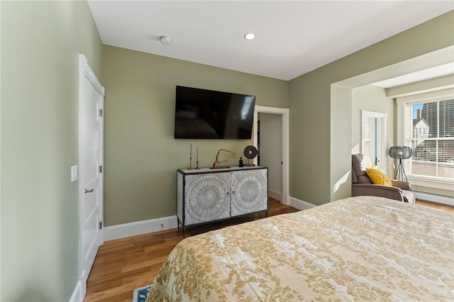 bedroom with hardwood / wood-style floors