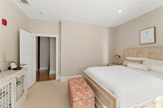 bedroom featuring light colored carpet