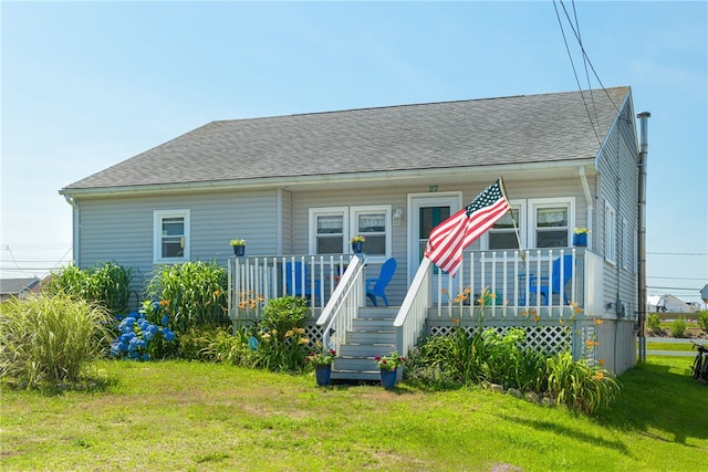 back of house with a yard and a deck