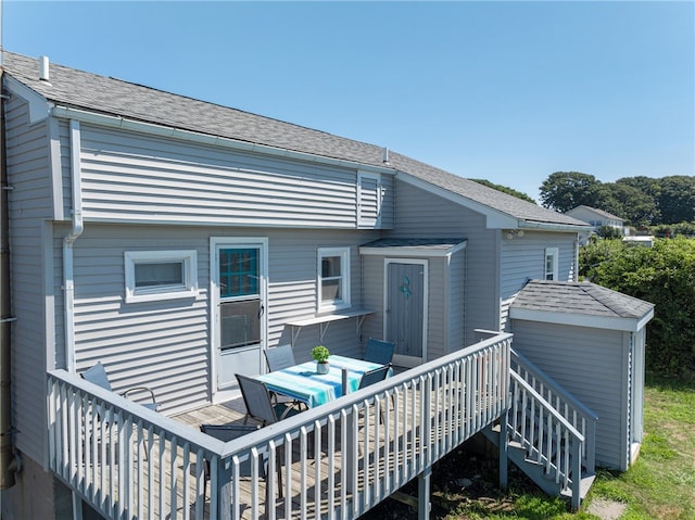 rear view of house with a wooden deck