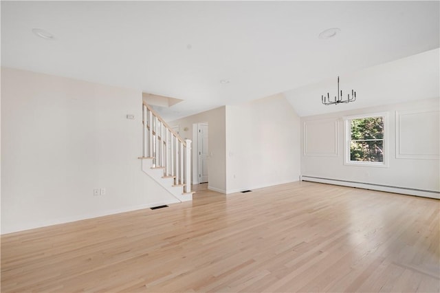 unfurnished living room featuring light hardwood / wood-style flooring, a baseboard radiator, a chandelier, and vaulted ceiling