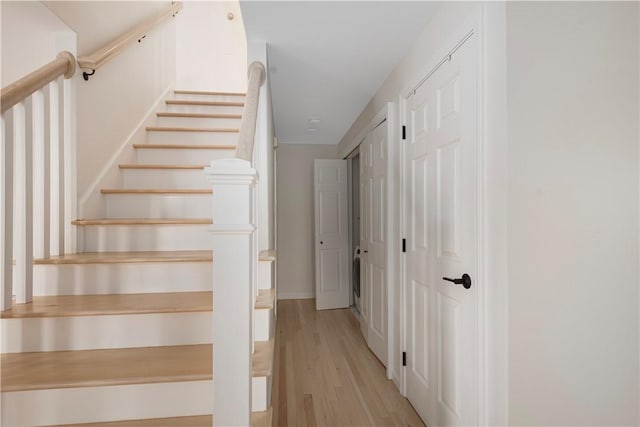 stairway featuring hardwood / wood-style flooring