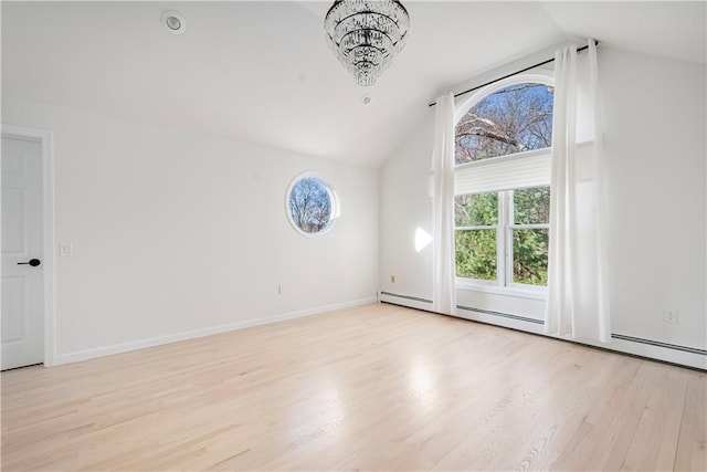 unfurnished room with baseboard heating, vaulted ceiling, light hardwood / wood-style flooring, and a notable chandelier