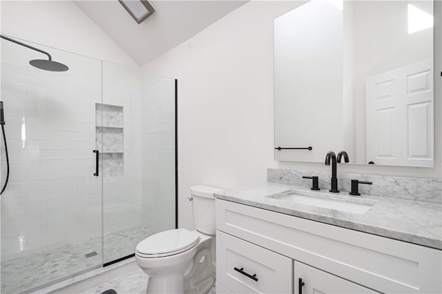 bathroom featuring a shower with door, vanity, lofted ceiling, and toilet