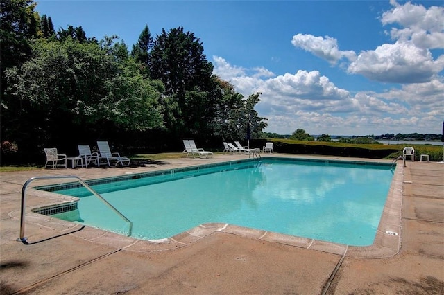 view of swimming pool with a patio