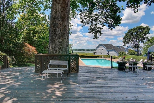 view of swimming pool with a deck