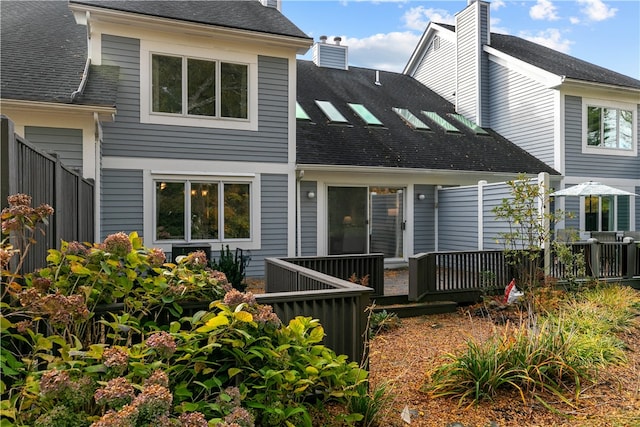 rear view of property with a deck