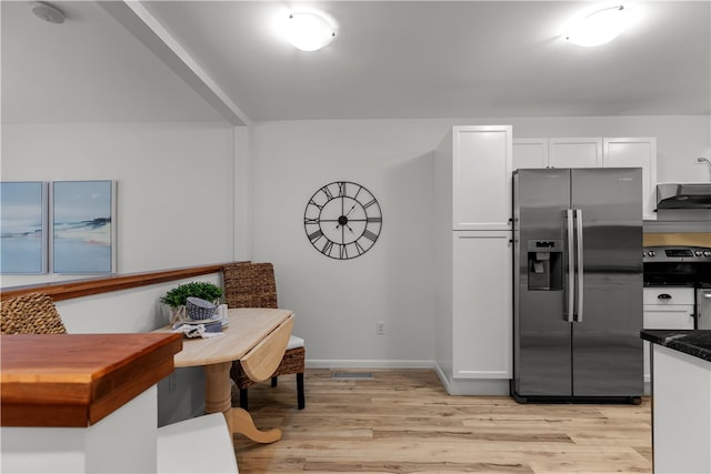 kitchen featuring white cabinetry, light hardwood / wood-style flooring, and stainless steel appliances