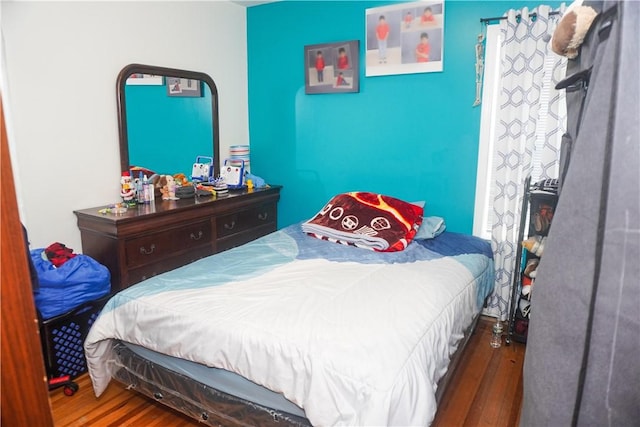 bedroom featuring dark wood-type flooring