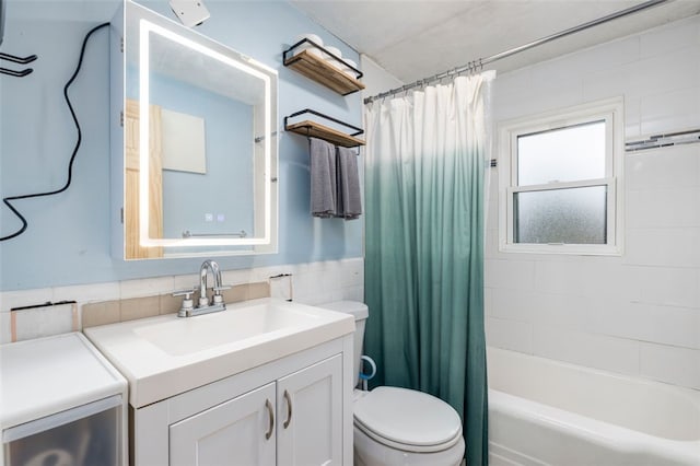 full bathroom featuring toilet, vanity, and shower / tub combo with curtain