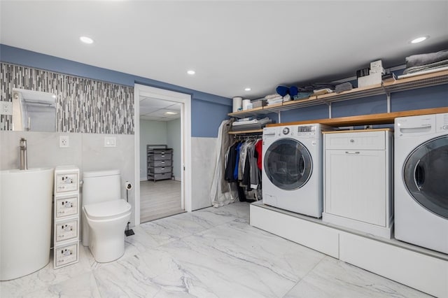 washroom featuring washer and dryer