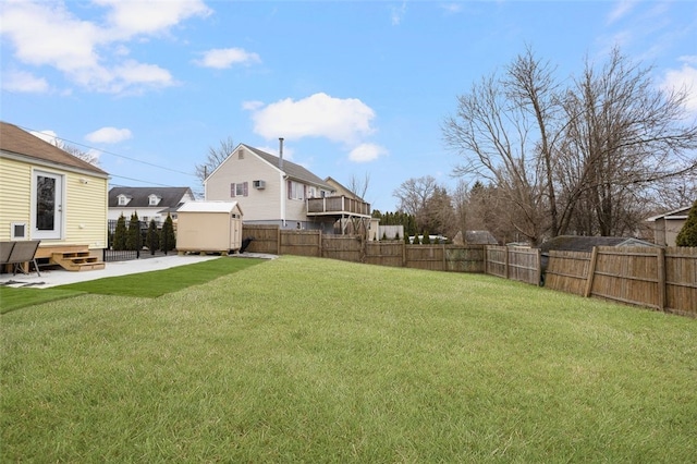 view of yard with a patio and a shed