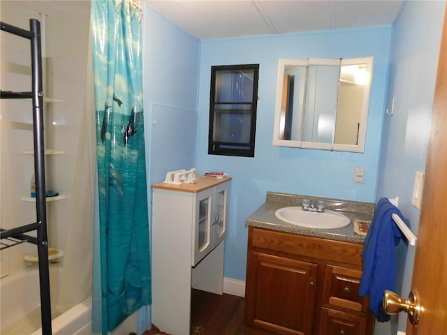 bathroom featuring vanity and shower / tub combo with curtain