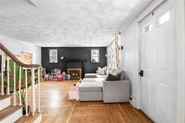 living room with parquet flooring and a fireplace