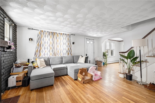 living room featuring light hardwood / wood-style floors and a baseboard radiator