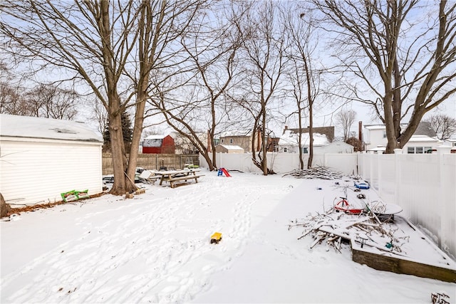 view of yard layered in snow