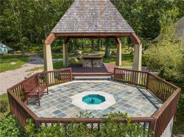 wooden deck with a gazebo and a patio