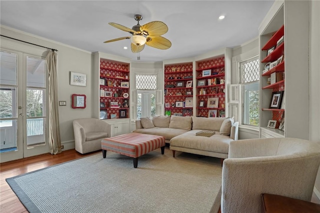 living room with wood-type flooring, french doors, and plenty of natural light