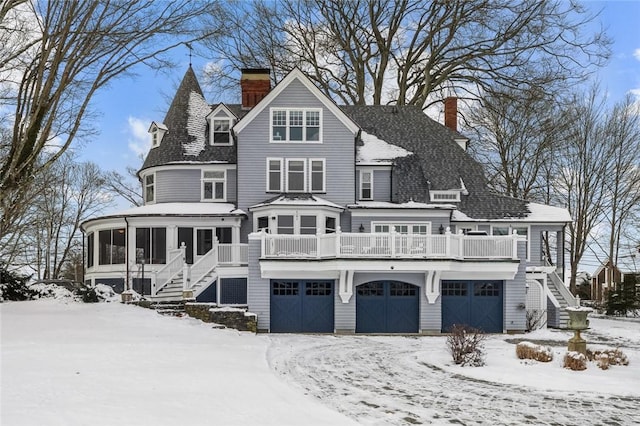 view of front of home with a sunroom