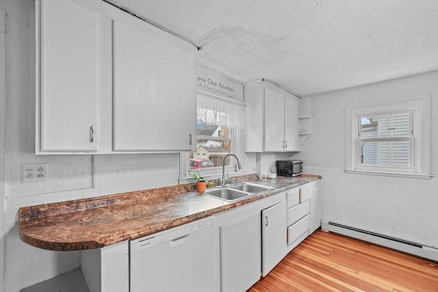 kitchen with dishwasher, a baseboard heating unit, sink, white cabinets, and light hardwood / wood-style floors