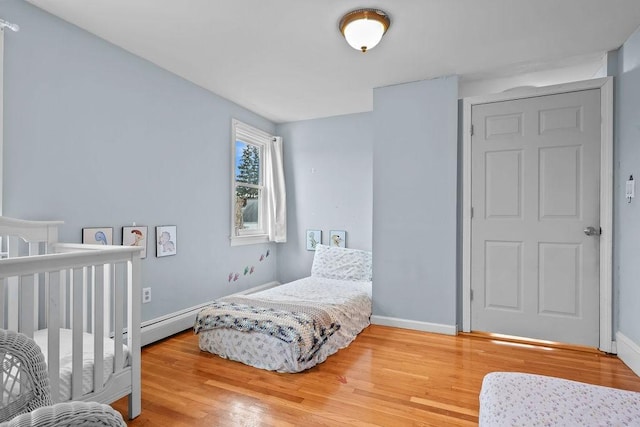 bedroom with hardwood / wood-style flooring