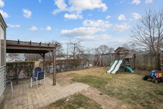 view of yard with a patio and a playground