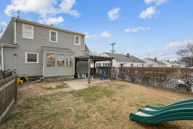 back of property featuring a patio, a playground, a pergola, and a yard