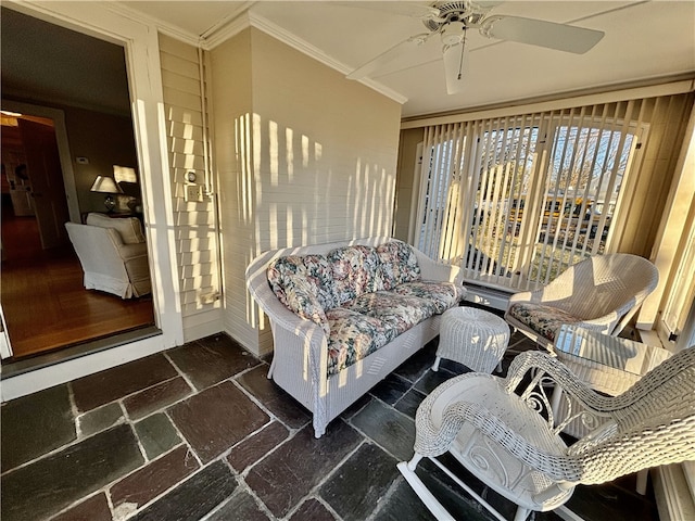 interior space with ceiling fan