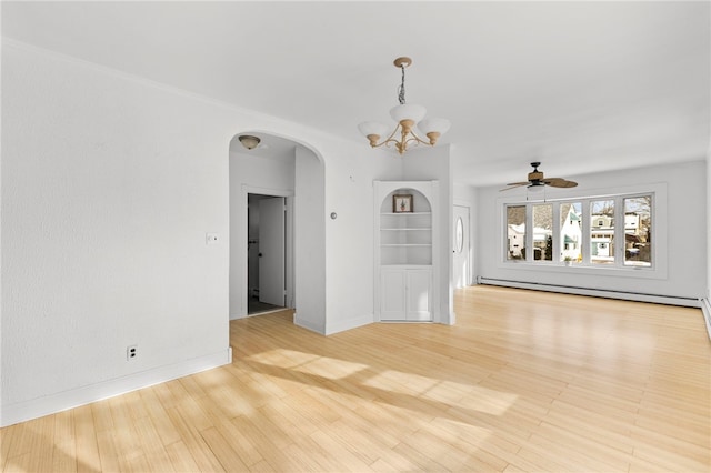 spare room featuring ceiling fan with notable chandelier, light hardwood / wood-style flooring, and baseboard heating