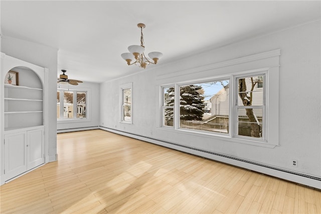 unfurnished dining area featuring built in shelves, baseboard heating, light hardwood / wood-style floors, and ceiling fan with notable chandelier