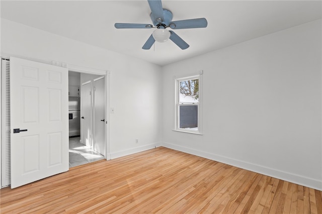 unfurnished bedroom featuring light wood-type flooring and ceiling fan