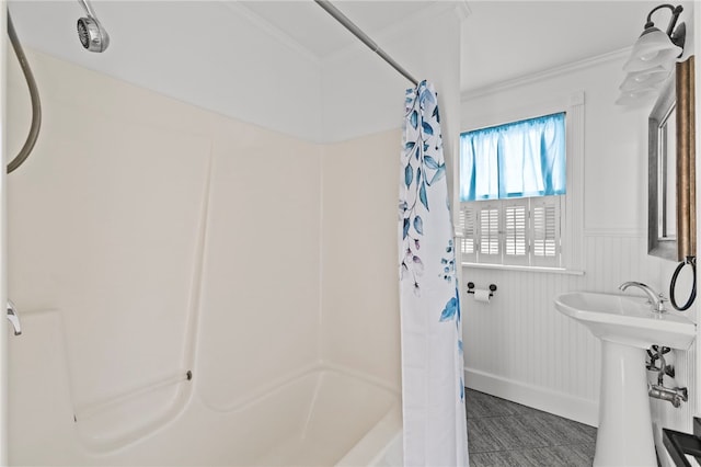 bathroom featuring shower / bathtub combination with curtain and ornamental molding