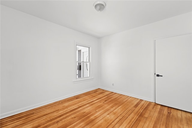 empty room with wood-type flooring