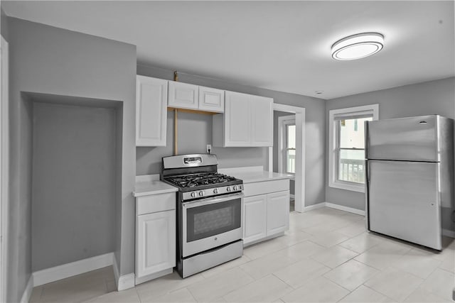 kitchen featuring white cabinetry and appliances with stainless steel finishes