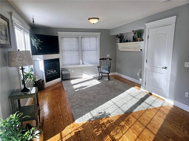 unfurnished room with wood-type flooring