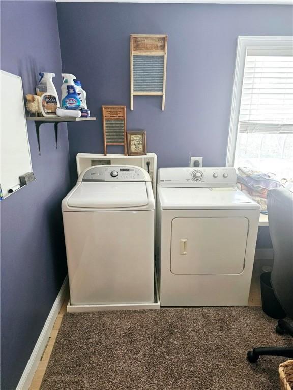 washroom with independent washer and dryer