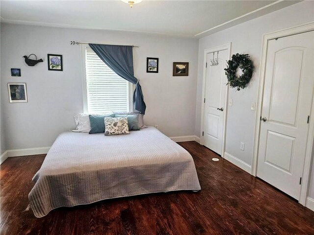 bedroom featuring dark hardwood / wood-style flooring